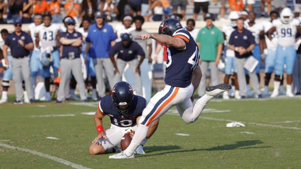 Virginia Cavaliers punter Brendan Farrell, 40, kicks the winning field goal in the final game of the fourth quarter against the Old Dominion Monarchs at Scott Stadium.