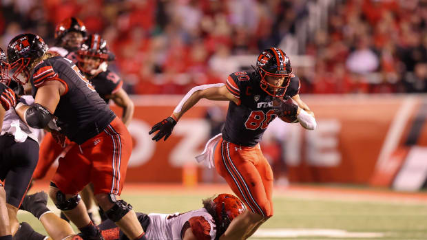 Utah Utes tight end Brant Kuithe (80) catches a pass and is brought down by San Diego State Aztecs defensive lineman Justus Tavai (91) in the second quarter at Rice-Eccles Stadium.