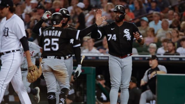 Sep 17, 2022; Detroit, Michigan, USA; Chicago White Sox left fielder Eloy Jimenez (74) and center fielder Luis Robert (88) celebrate as first baseman Andrew Vaughn (25) scores a run against the Detroit Tigers at Comerica Park. Mandatory Credit: Brian Sevald-USA TODAY Sports