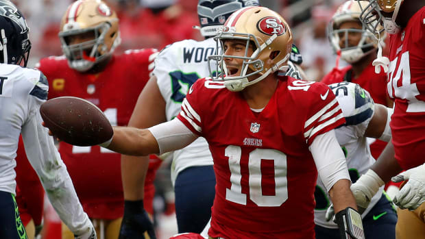 Jimmy Garoppolo smiles after a play during the 49ers' victory over the Seahawks