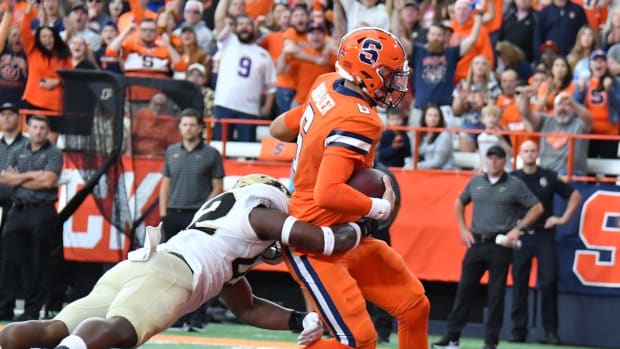 Sep 17, 2022; Syracuse, New York, USA; Syracuse Orange quarterback Garrett Shrader (6) beats a tackle by Purdue Boilermakers linebacker Clyde Washington (42) to score a two point conversion in the fourth quarter at JMA Wireless Dome. Mandatory Credit: Mark Konezny-USA TODAY Sports