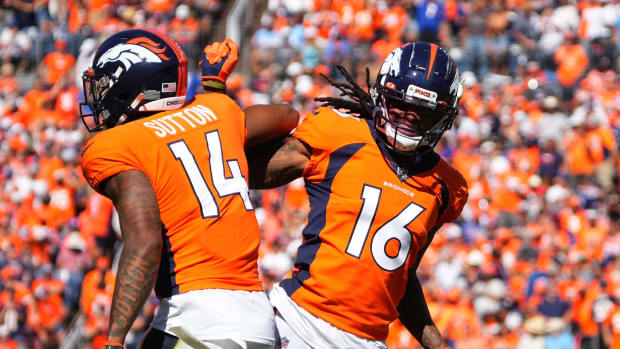 Denver Broncos wide receiver Courtland Sutton (14) and wide receiver Tyrie Cleveland (16) react after a play in the first quarter against the Houston Texans at Empower Field at Mile High.