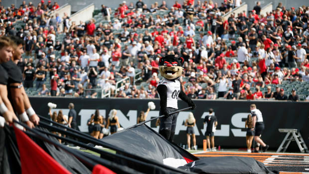 The University of Cincinnati Bearcat waves a flag before the start of the first quarter of the NCAA football game between the Cincinnati Bearcats and the Miami RedHawks at Paycor Stadium in Cincinnati on Saturday, Sept. 17, 2022. The Cincinnati Bearcats defeated the Miami (Oh) Redhawks 38-17 in the 126th Battle for the Victory Bell. Cincinnati Bearcats Football Vs Miami Redhawks Sept 17 2022