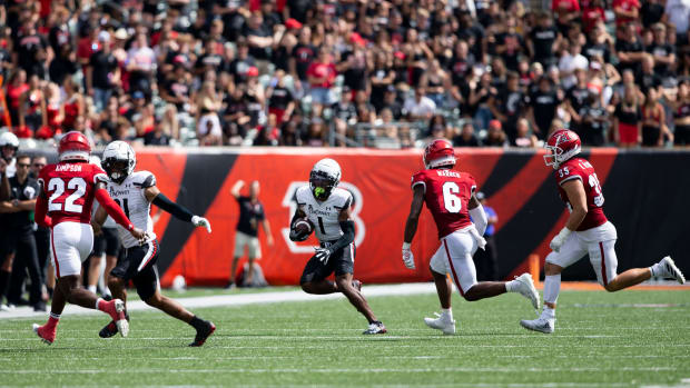 Cincinnati Bearcats wide receiver Tre Tucker (1) runs toward the end zone during the third quarter of the NCAA football game between the Cincinnati Bearcats and the Miami RedHawks at Paycor Stadium in Cincinnati on Saturday, Sept. 17, 2022. The Cincinnati Bearcats defeated the Miami (Oh) Redhawks 38-17 in the 126th Battle for the Victory Bell. Cincinnati Bearcats Football Vs Miami Redhawks Sept 17 2022