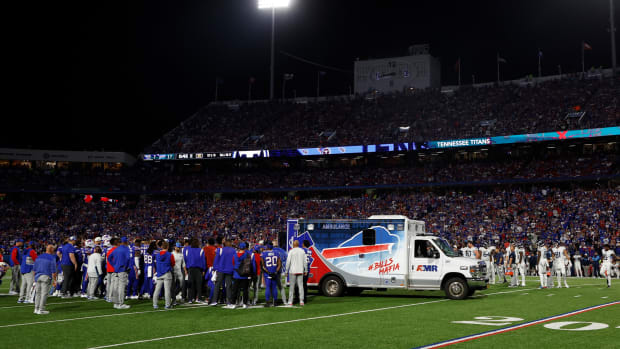 Players gather around an ambulance on the field after an injury to Buffalo Bills’ Dane Jackson during the first half of an NFL football game against the Tennessee Titans, Monday, Sept. 19, 2022, in Orchard Park, N.Y.
