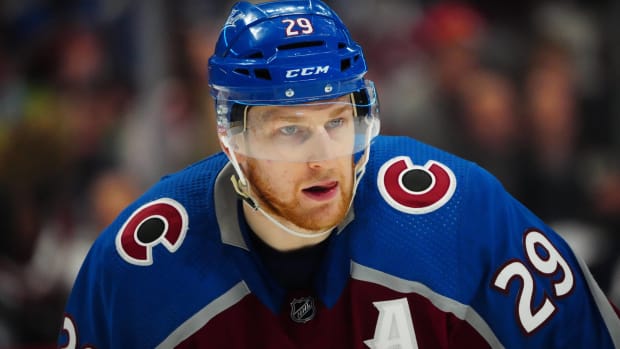 Avalanche forward Nathan MacKinnon waits for a face-off during a game.