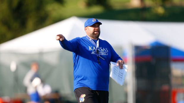 Kansas offensive coordinator Andy Kotelnicki works with players during a practice in 2021 at the University of Kansas.
