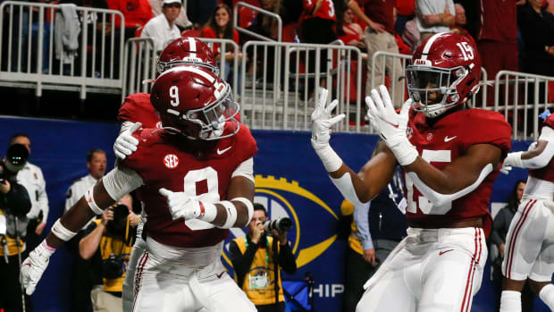 Alabama Crimson Tide defensive back Jordan Battle (9) and linebacker Dallas Turner (15) celebrate after an interception return by Battle for a touchdown against the Georgia Bulldogs during the SEC championship