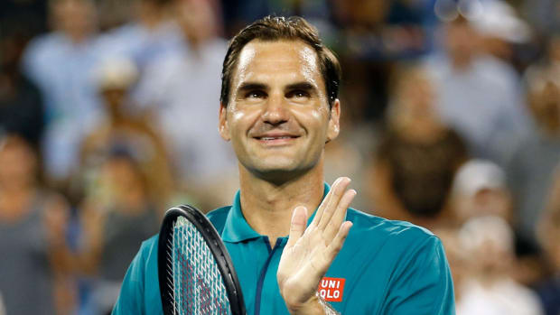 Roger Federer claps for fans as they cheer him on after the Western & Southern Open match on Aug. 13, 2019.