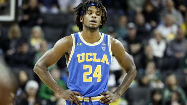 Former UCLA forward Jalen Hill has his hands on his hips during a 2020 game.
