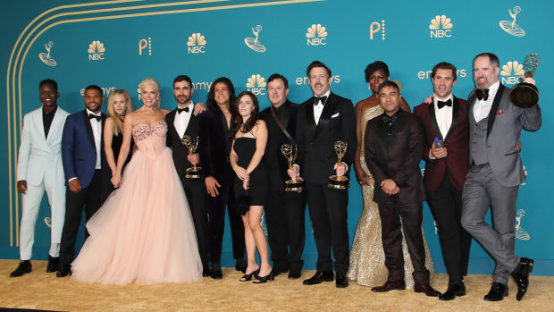Sep 12, 2022; Los Angeles, CA, USA; The cast of Ted Lasso poses with its award for outstanding comedy series in the photo room at the 74th Emmy Awards at the Microsoft Theater in Los Angeles on Sept. 12, 2022.