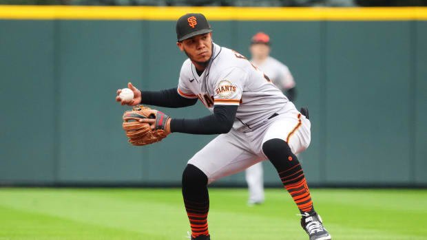 SF Giants infielder Thairo Estrada touches second base in a game against the Rockies on September 22, 2022.