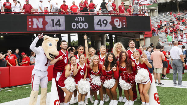 Oklahoma Sooners cheerleaders pose for a photo after the game against the Nebraska Cornhuskers at Memorial Stadium.