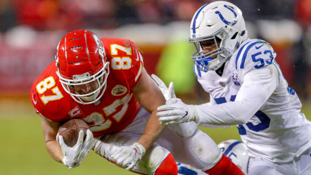 Kansas City Chiefs tight end Travis Kelce (87) gets the first down and is brought down shortly after by Indianapolis Colts outside linebacker Darius Leonard (53) and cornerback Pierre Desir (35) in the third quarter at Arrowhead Stadium in Kansas City, Mo., on Saturday, Jan. 12, 2019. Indianapolis Colts Play The Kansas City Chiefs At Arrowhead Stadium In Afc Playoffs 2019