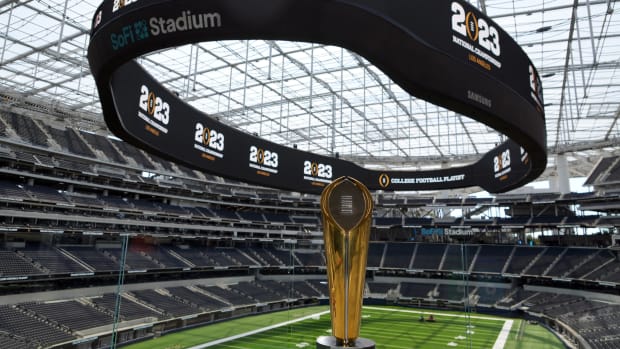 The College Football Playoff National Championship trophy on display during a 2023 CFP National Championship Kickoff press conference at SoFi Stadium.