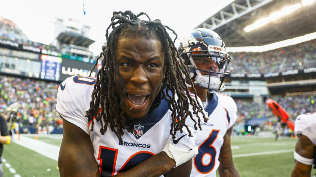 Denver Broncos wide receiver Jerry Jeudy (10) celebrates on the sideline after catching a touchdown pass against the Seattle Seahawks during the second quarter at Lumen Field.