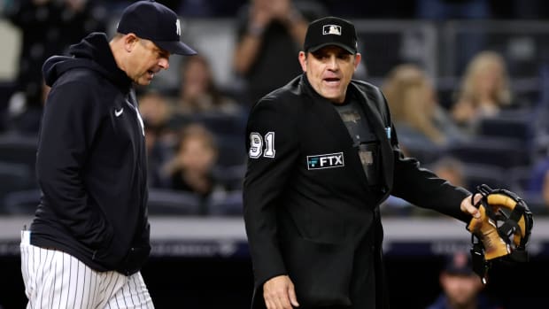 New York Yankees manager Aaron Boone argues with home plate umpire Brian Knight (91) after being ejected during the sixth inning of the team’s baseball game against the Boston Red Sox on Friday, Sept. 23, 2022, in New York. (AP Photo/Adam Hunger)