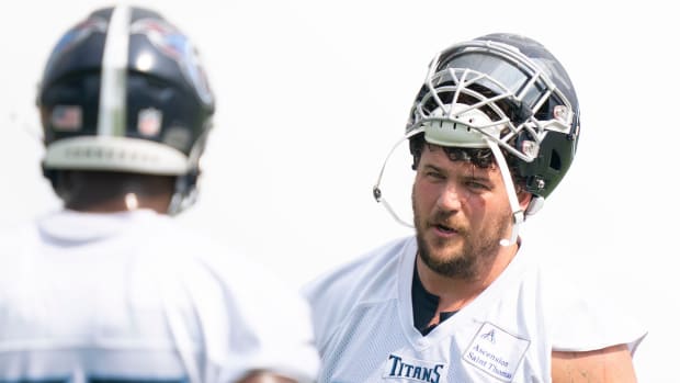 Tennessee Titans offensive tackle Taylor Lewan (77) gives instruction to offensive lineman Nicholas Petit-Frere (78) during practice at Saint Thomas Sports Park Tuesday, June 7, 2022, in Nashville, Tenn.