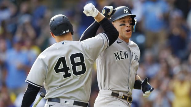 Sep 18, 2022; Milwaukee, Wisconsin, USA; New York Yankees center fielder Aaron Judge (99) celebrates with first baseman Anthony Rizzo (48) after hitting a home run during the seventh inning against the Milwaukee Brewers at American Family Field. Mandatory Credit: Jeff Hanisch-USA TODAY Sports
