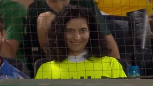 A fan promoting the horror movie “Smile” at the Mets at Athletics game.