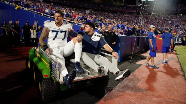 Titans offensive tackle Taylor Lewan is carted off the field after suffering a knee injury vs. Buffalo.