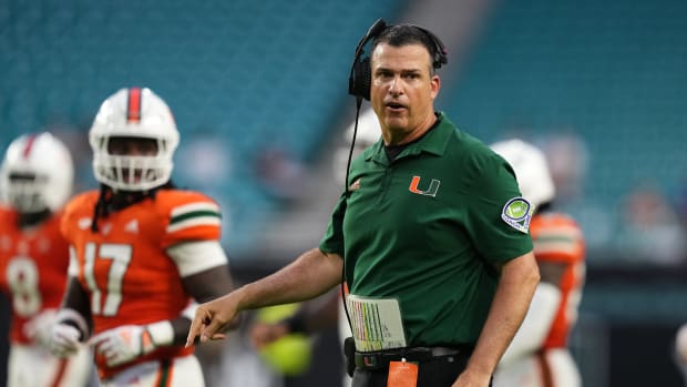 Miami Hurricanes head coach Mario Cristobal walks onto the field during the second half against the Middle Tennessee Blue Raiders at Hard Rock Stadium.