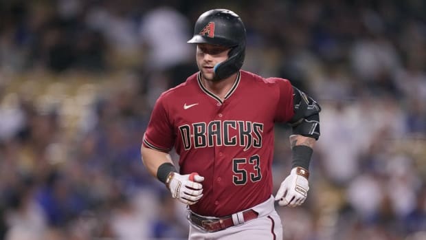 Sep 22, 2022; Los Angeles, California, USA; Arizona Diamondbacks designated hitter Christian Walker (53) rounds the bases after hitting a solo home run in the ninth inning against the Los Angeles Dodgers at Dodger Stadium. Mandatory Credit: Kirby Lee-USA TODAY Sports