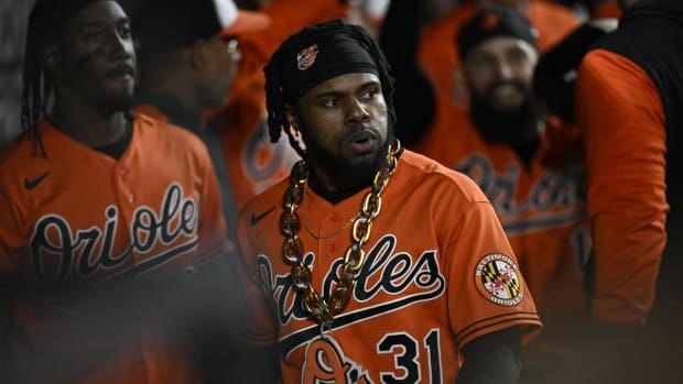 Sep 24, 2022; Baltimore, Maryland, USA; Baltimore Orioles center fielder Cedric Mullins (31) wears the home run chain in the dugout during the fourth inning against the Houston Astros at Oriole Park at Camden Yards. Mandatory Credit: James A. Pittman-USA TODAY Sports