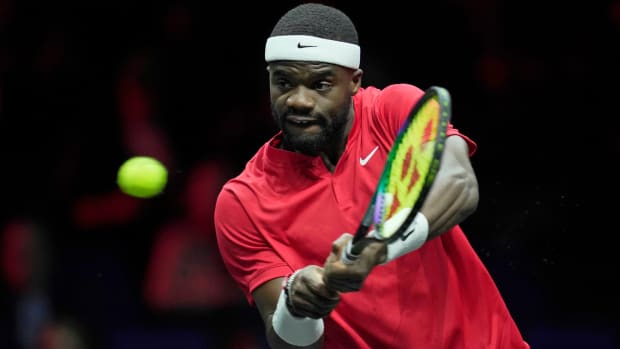 Team Wold’s Frances Tiafoe plays a return to Team Europe’s Stefanos Tsitsipas during their singles tennis match on the third day of the Laver Cup tennis tournament at the O2 arena in London.