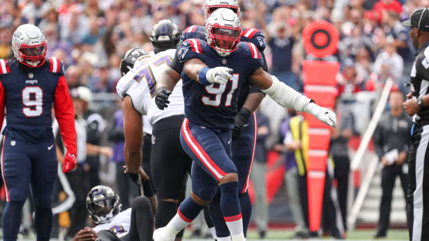 Sep 25, 2022; Foxborough, Massachusetts, USA; New England Patriots defensive end Deatrich Wise Jr (91) reacts after sacking Baltimore Ravens quarterback Lamar Jackson (8) during the first half at Gillette Stadium.