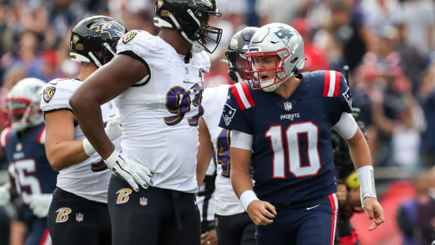 Sep 25, 2022; Foxborough, Massachusetts, USA; New England Patriots quarterback Mac Jones (10) reacts after scoring a touchdown during the first half against the Baltimore Ravens at Gillette Stadium.