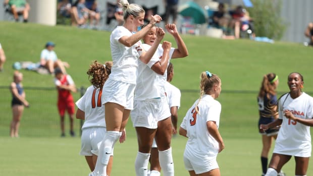 Haley Hopkins celebrates after scoring a goal for the Virginia women's soccer team.