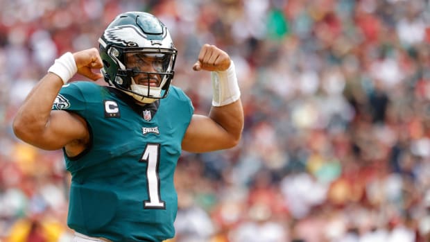 Philadelphia Eagles quarterback Jalen Hurts (1) celebrates after throwing a touchdown pass against the Washington Commanders during the second quarter at FedExField.