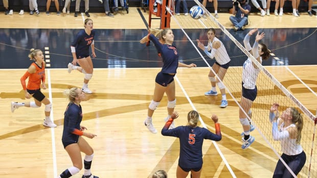 Abby Tadder swings at the ball during the Virginia Cavaliers' volleyball match against the North Carolina Tar Heels.