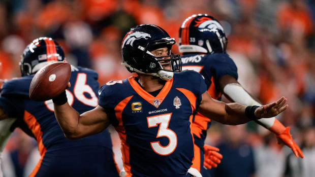 Denver Broncos quarterback Russell Wilson (3) attempts a throw in the fourth quarter against the San Francisco 49ers at Empower Field at Mile High.