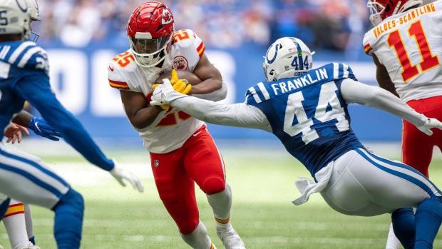 Sep 25, 2022; Indianapolis, Indiana, USA; Kansas City Chiefs running back Clyde Edwards-Helaire (25) runs the ball while defended by Indianapolis Colts linebacker Zaire Franklin (44) during the second half at Lucas Oil Stadium. Mandatory Credit: Marc Lebryk-USA TODAY Sports