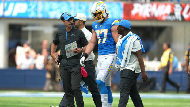 Sep 25, 2022; Inglewood, California, USA; Los Angeles Chargers linebacker Joey Bosa (97) walks off the field with Brandon Staley after suffering an injury against the Jacksonville Jaguars in the first half at SoFi Stadium. Mandatory Credit: Kirby Lee-USA TODAY Sports