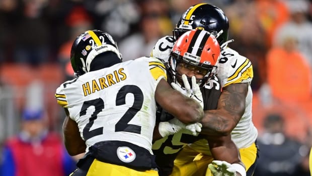 Sep 22, 2022; Cleveland, Ohio, USA; Cleveland Browns defensive end Myles Garrett (95) is blocked by Pittsburgh Steelers running back Najee Harris (22) and offensive tackle Dan Moore Jr. (65) during the fourth quarter at FirstEnergy Stadium. Mandatory Credit: David Dermer-USA TODAY Sports