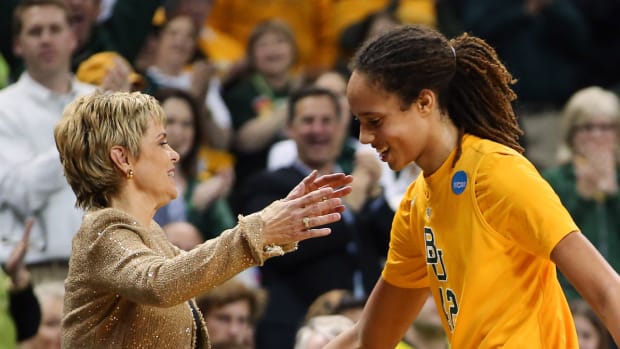 Baylor Bears center Brittney Griner (42) greets head coach Kim Mulkey after coming out of the game during the 2013 NCAA women’s basketball tournament.