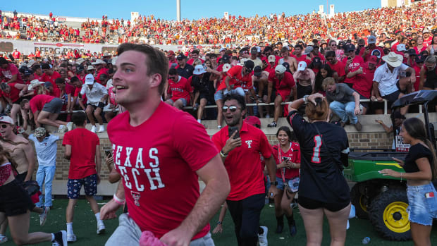 Texas Tech fans rush the field after the 37-34 win over the Texas Longhorns at Jones AT&T Stadium in Lubbock, Texas on Sept. 24, 2022. Crowd
