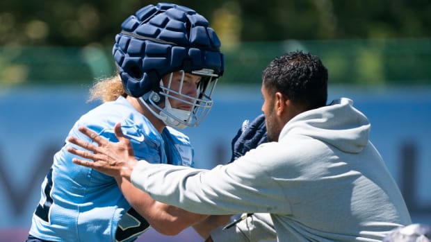 Sep 8, 2022; Nashville, Tennessee USA; Tennessee Titans linebacker Derrek Tuszka (59) works with outside linebackers coach Ryan Crow during practice at Ascension Saint Thomas Sports Park. Mandatory Credit: George Walker IV-USA TODAY Sports