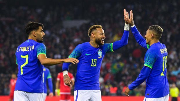 Neymar (center) pictured celebrating with Raphinha (right) during Brazil's 5-1 win over Tunisia in September 2022