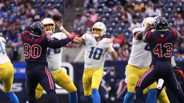 Dec 26, 2021; Houston, Texas, USA; Los Angeles Chargers quarterback Justin Herbert (10) attempts a pass during the first quarter against the Houston Texans at NRG Stadium. Mandatory Credit: Troy Taormina-USA TODAY Sports