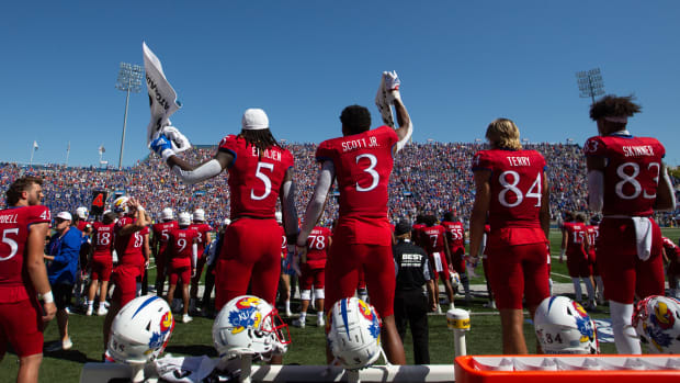The Kansas bench yells out and cheers as the final seconds of Saturday's game against Duke winds down at David Booth Kansas Memorial Stadium.