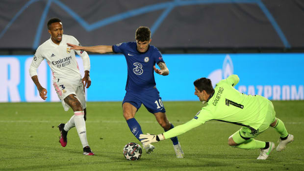Christian Pulisic pictured (center) dribbling around Real Madrid goalkeeper Thibaut Courtois before scoring for Chelsea in April 2021