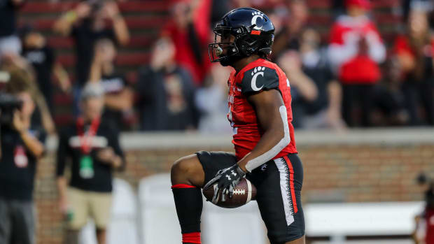 Sep 24, 2022; Cincinnati, Ohio, USA; Cincinnati Bearcats running back Corey Kiner (2) reacts after scoring a touchdown against the Indiana Hoosiers in the second half at Nippert Stadium. Mandatory Credit: Katie Stratman-USA TODAY Sports