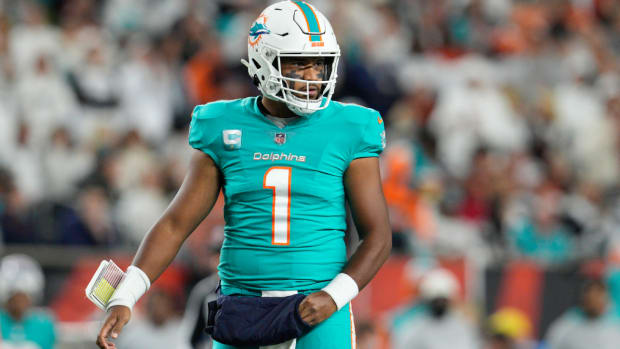 Miami Dolphins quarterback Tua Tagovailoa looks to the sidelines during the first half of an NFL football game against the Cincinnati Bengals, Thursday, Sept. 29, 2022, in Cincinnati. Tagovailoa suffered a second frightening injury in five days when he was carted off the field Thursday. (AP Photo/Jeff Dean)