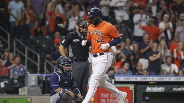 Sep 30, 2022; Houston, Texas, USA; Houston Astros designated hitter Yordan Alvarez (44) scores a run past Tampa Bay Rays catcher Francisco Mejia (21) on an RBI single by first baseman Yuli Gurriel (not pictured) during the fourth inning at Minute Maid Park. Mandatory Credit: Troy Taormina-USA TODAY Sports