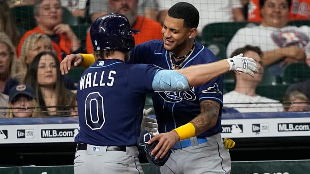 Rays' Taylor Walls celebrates with Jose Siri after hitting a home run.