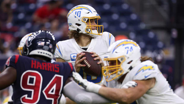 Dec 26, 2021; Houston, Texas, USA; Los Angeles Chargers quarterback Justin Herbert (10) in action during the game against the Houston Texans at NRG Stadium. Mandatory Credit: Troy Taormina-USA TODAY Sports